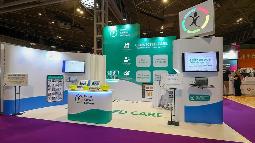 Exhibition stand and signage at a busy trade show